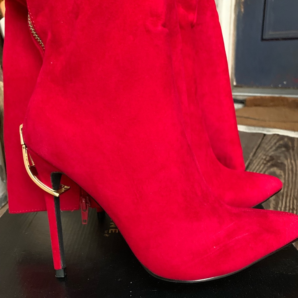 Red knee length boots